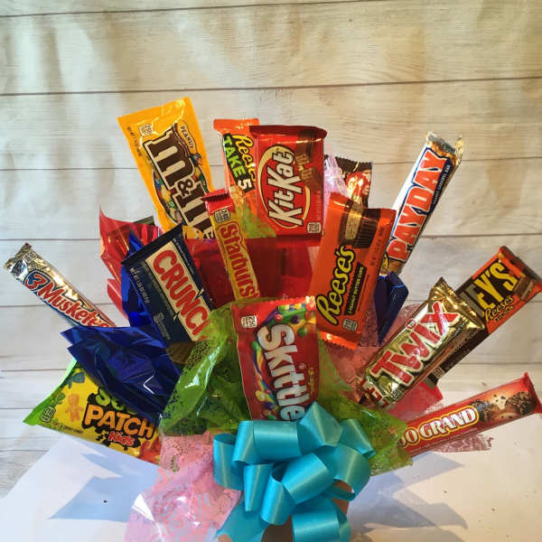 Candy bouquet in a pot with a blue ribbon bow
