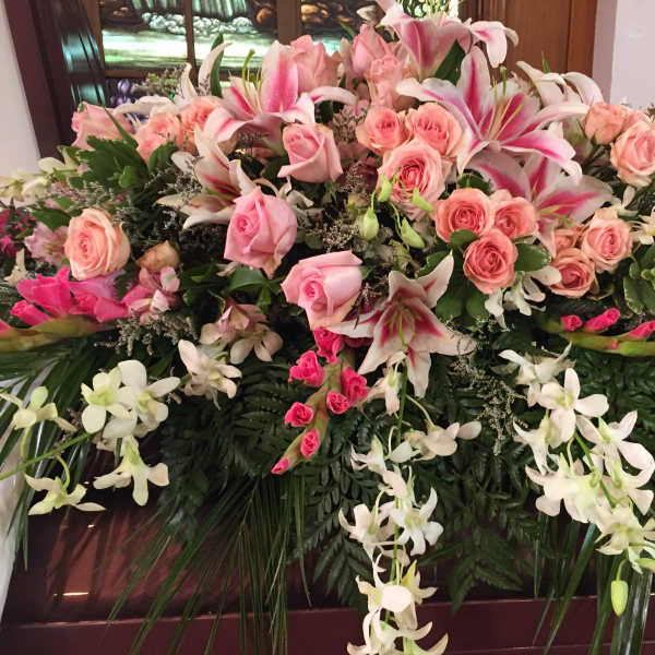 Large floral spray with pink roses and white lilies