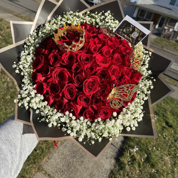 Large bouquet of red roses with white baby's breath and gold butterfly accents