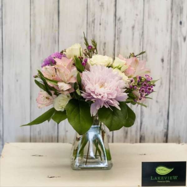 Pink and white mixed bouquet in a clear glass vase
