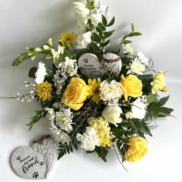 Yellow and white floral arrangement with memorial heart stones
