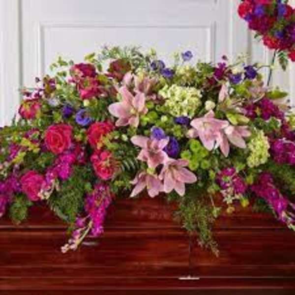 Large casket spray with pink and purple flowers