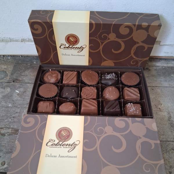 Open box of assorted chocolates in a decorative gift box