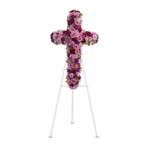 Purple floral cross on a white stand