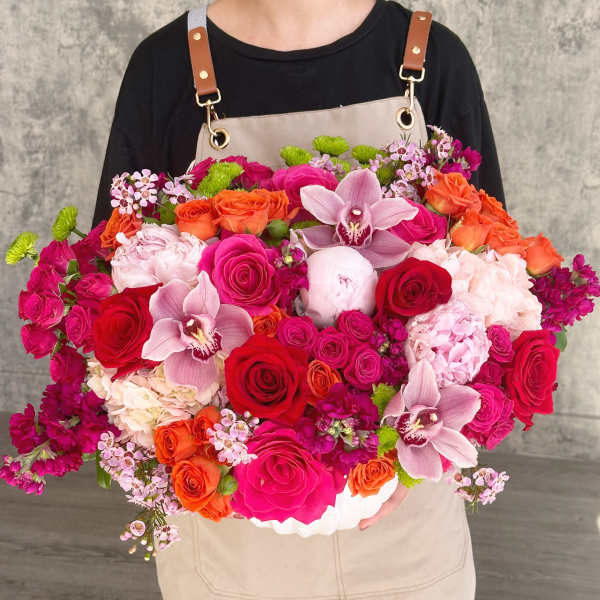 Large mixed bouquet with roses, orchids, and pink hydrangeas