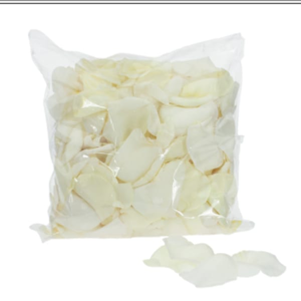 Bag of ivory rose petals with a few loose petals scattered in front