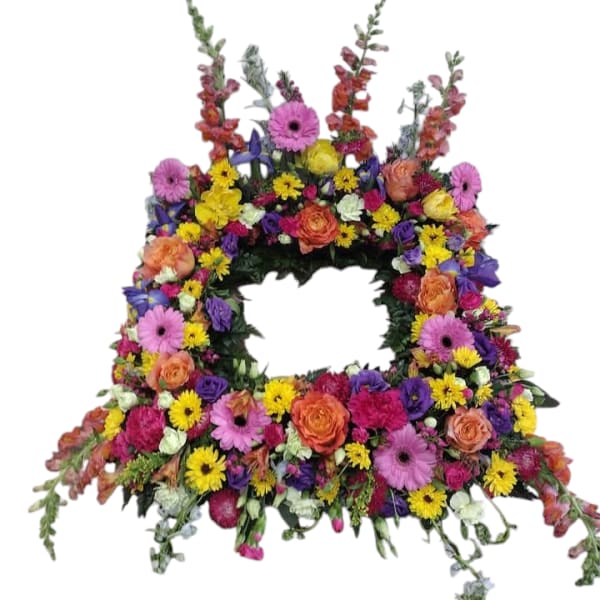 Large floral wreath with a central opening and multicolored blooms