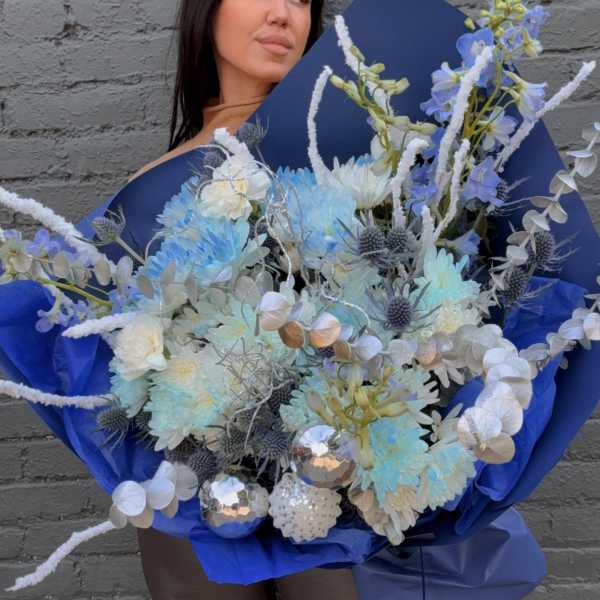 Large blue bouquet with pale flowers and silver accents