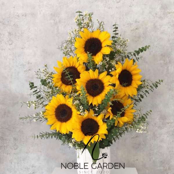 Bouquet of sunflowers in a white vase