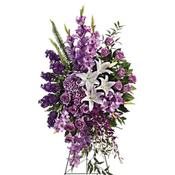 Tall purple and white floral standing spray on an easel