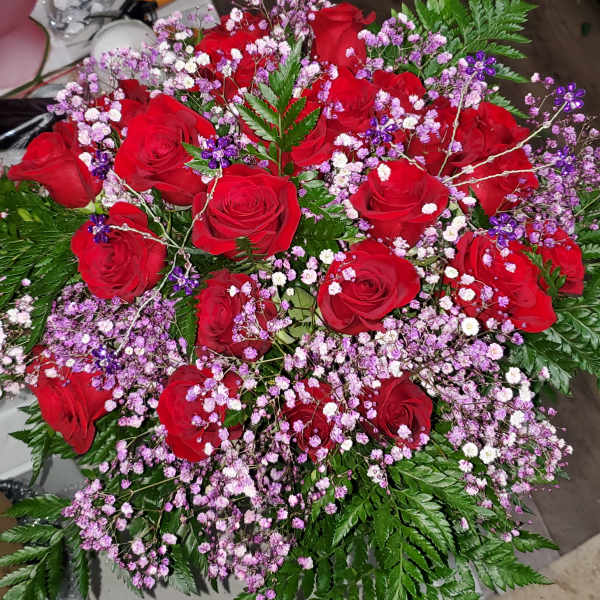 two dozen rose cut bouquet with baby's-breath and greenery