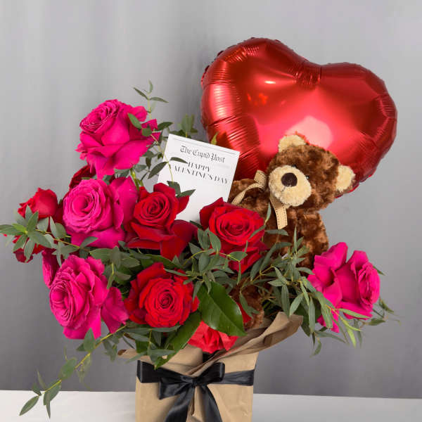 Bouquet of red and pink roses with a teddy bear and heart balloon