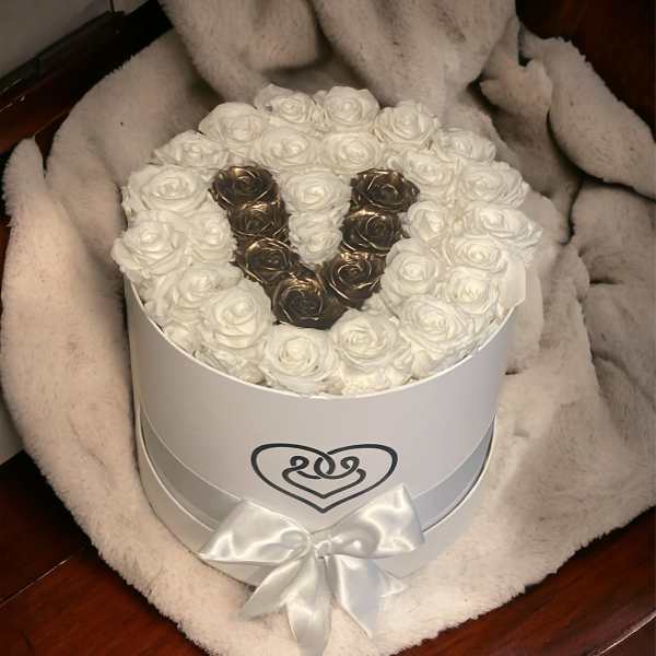White rose box with a heart-shaped gold rose design and satin bow