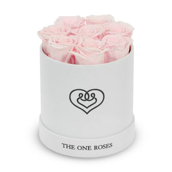 Pink roses arranged in a white round box with a heart logo