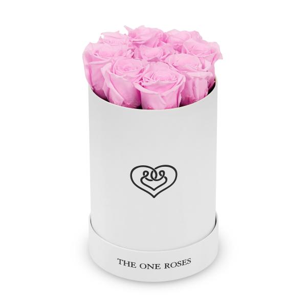 Pink roses arranged in a white cylindrical box