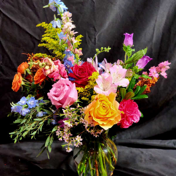 Colorful mixed bouquet in a clear glass vase