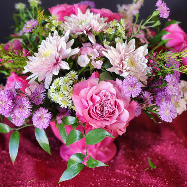 Pink rose bouquet with pale chrysanthemums and purple daisies