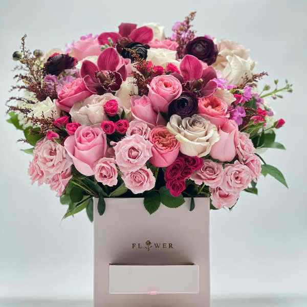 Pink and white rose bouquet in a square gift box
