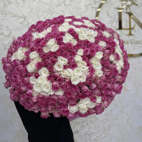 Large round bouquet of pink and white roses