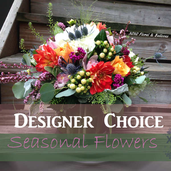 Colorful mixed flower bouquet with a designer choice sign