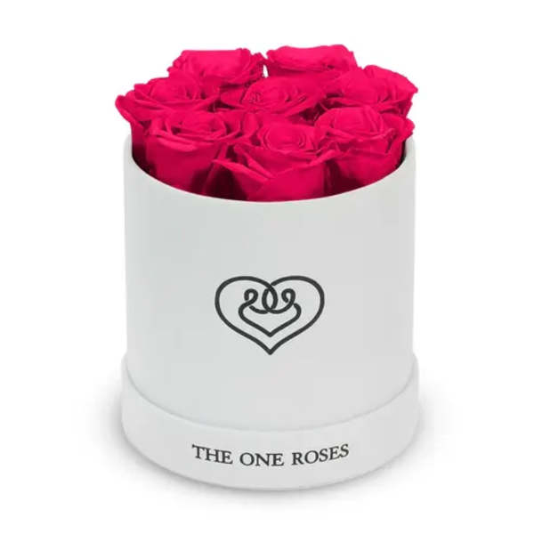 Hot pink roses arranged in a white round box