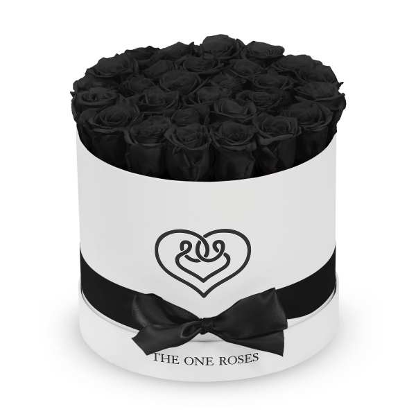 Black roses arranged in a round white box with a black ribbon