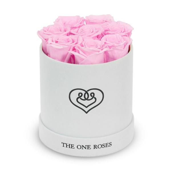 Pink roses arranged in a white round box with a heart logo