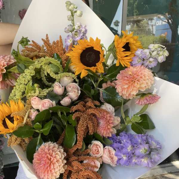 Large mixed bouquet with sunflowers, pink dahlias, and lavender blooms