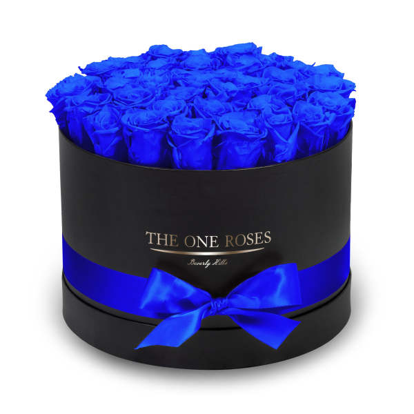 Round box of vivid blue roses with a blue ribbon