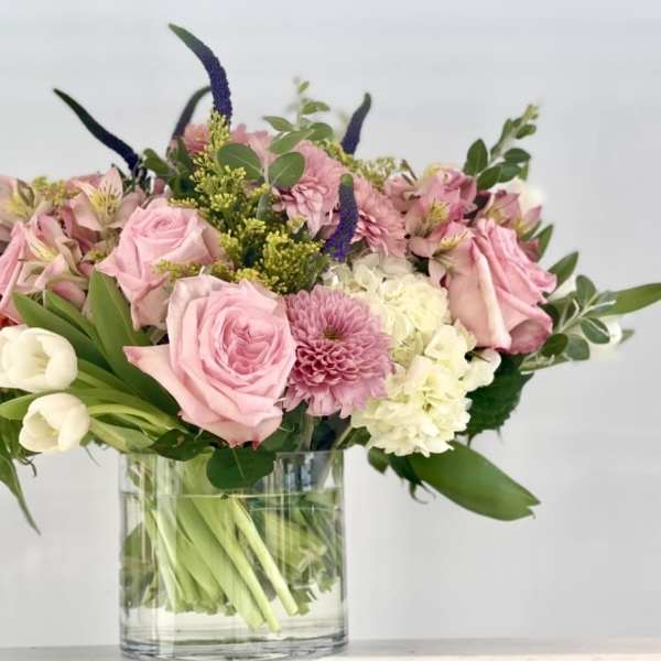 Pink and white mixed bouquet in a clear glass vase