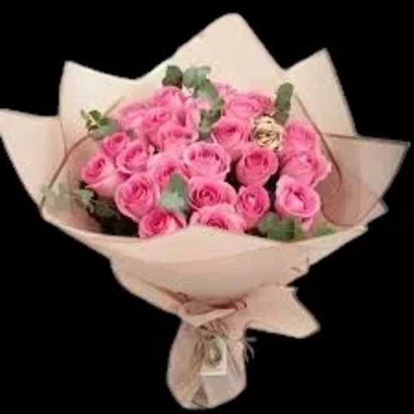 Bouquet of pink roses wrapped in pale paper