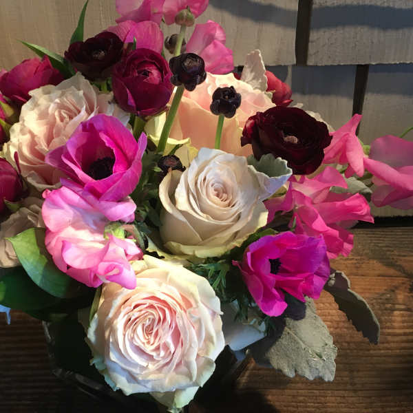 Bouquet of pink, white, and burgundy flowers in a vase