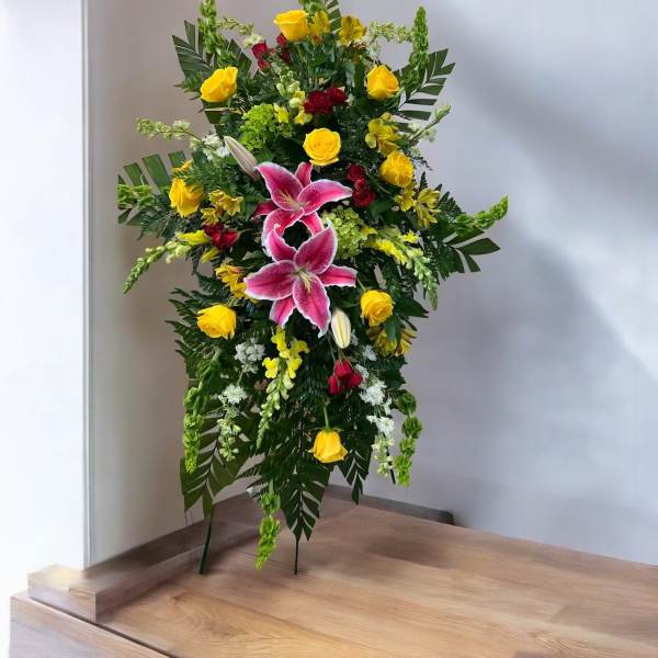 Standing floral spray with pink lilies and yellow roses