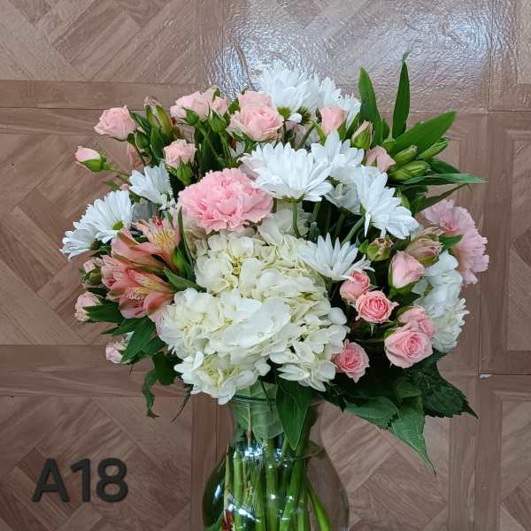 Pink and white bouquet in a glass vase