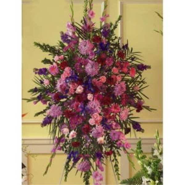 Tall standing floral spray with pink, purple, and red blooms