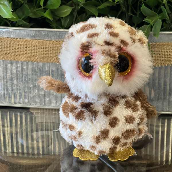 Plush owl figurine with glittery gold beak and feet