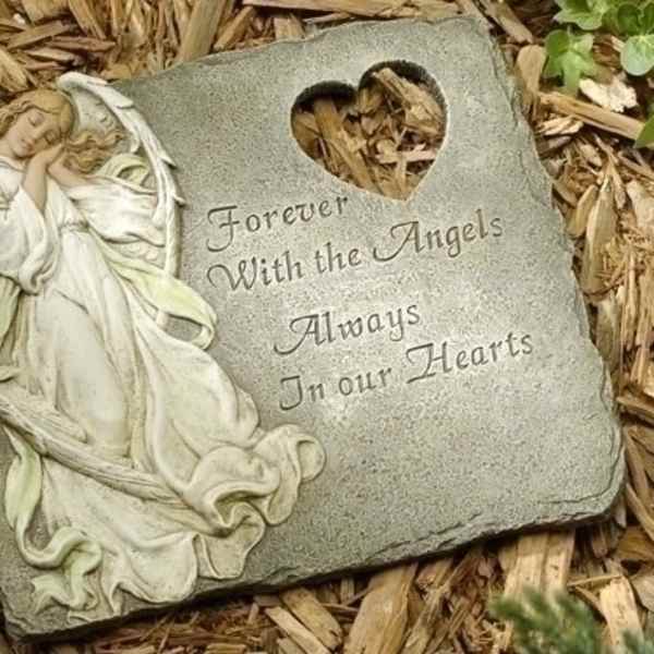 Memorial stone with an angel relief and heart cutout