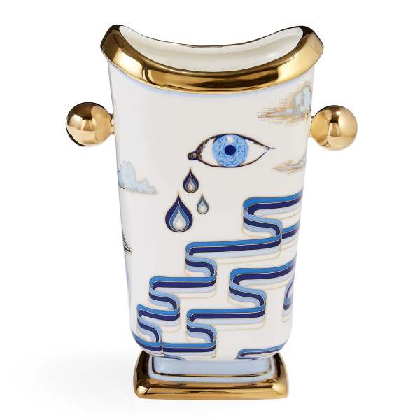 Decorative white ceramic vase with gold accents and blue eye motifs
