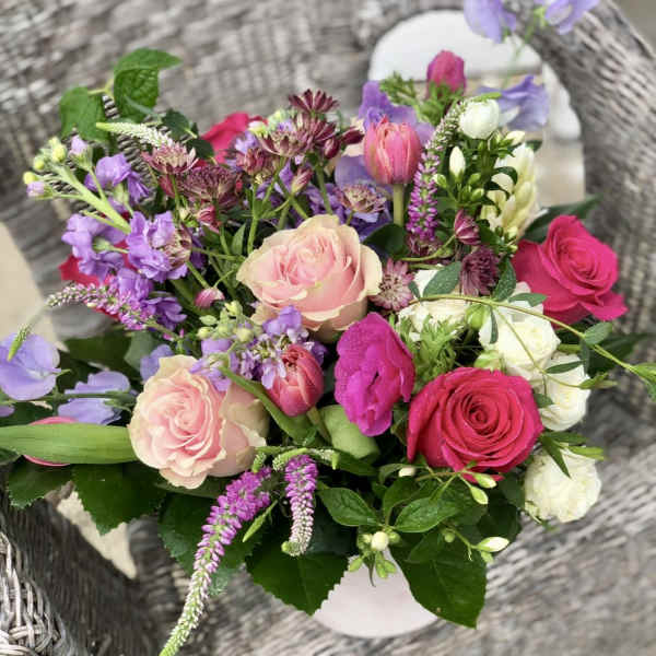 Mixed bouquet of pink, purple, and white flowers