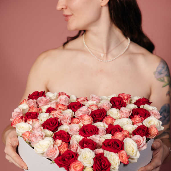 Heart-shaped box of red, pink, and white roses