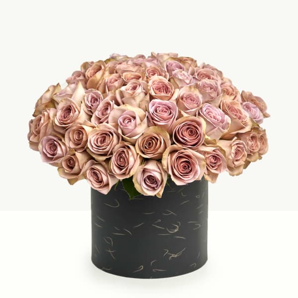 Bouquet of blush pink roses in a black cylindrical box