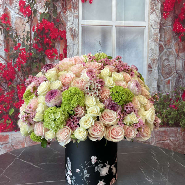 Large pastel rose arrangement in a black floral box