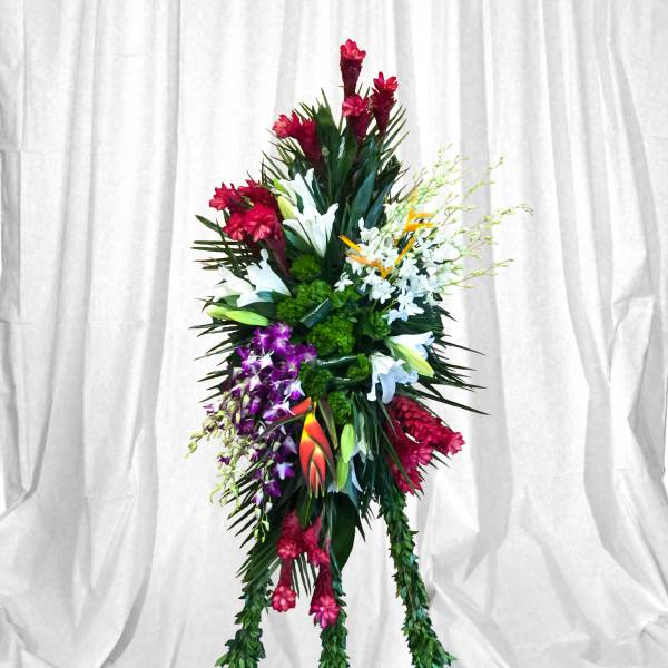 Tall tropical floral standing spray with red, white, purple, and orange blooms