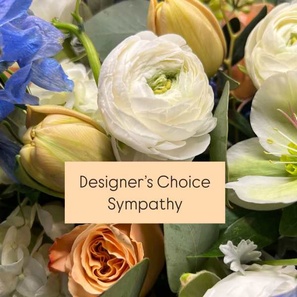 Mixed sympathy bouquet with white and peach blooms and blue flowers