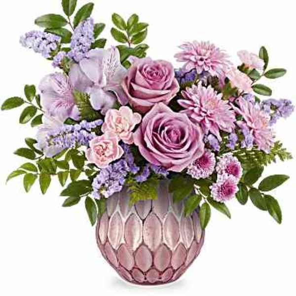Lavender and pink bouquet in a textured pink vase