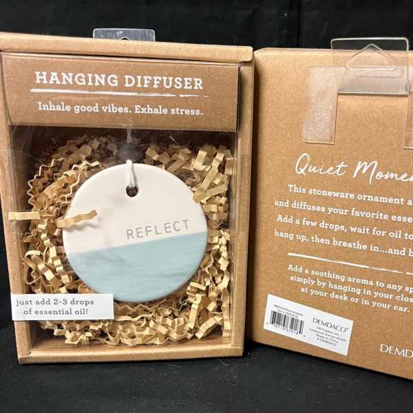 Two boxed hanging essential oil diffusers with round stoneware ornaments