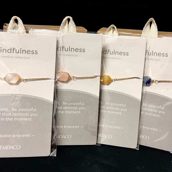 Packaged gemstone bracelets on display cards