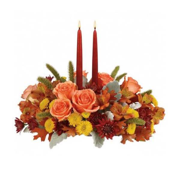 Autumn floral centerpiece with two red taper candles