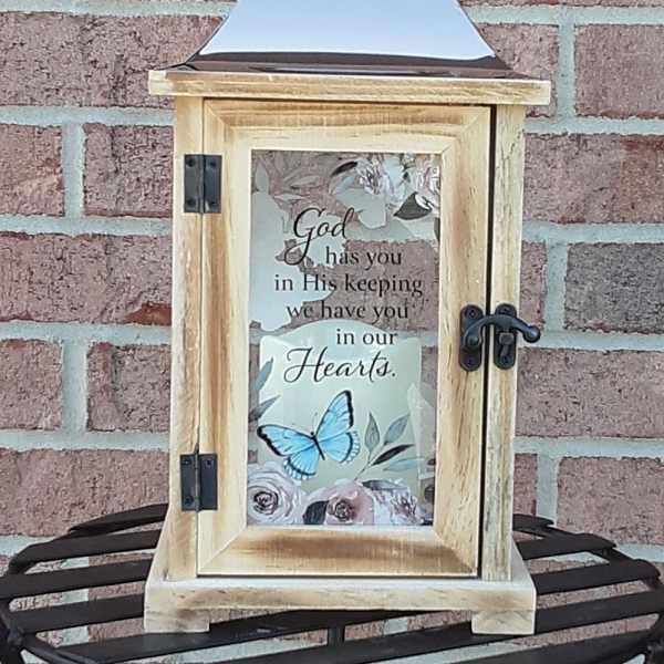 Wooden lantern with a sympathy message and butterfly design