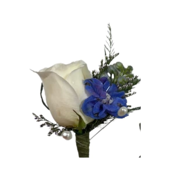 White rose boutonniere with blue flowers and pearl accents